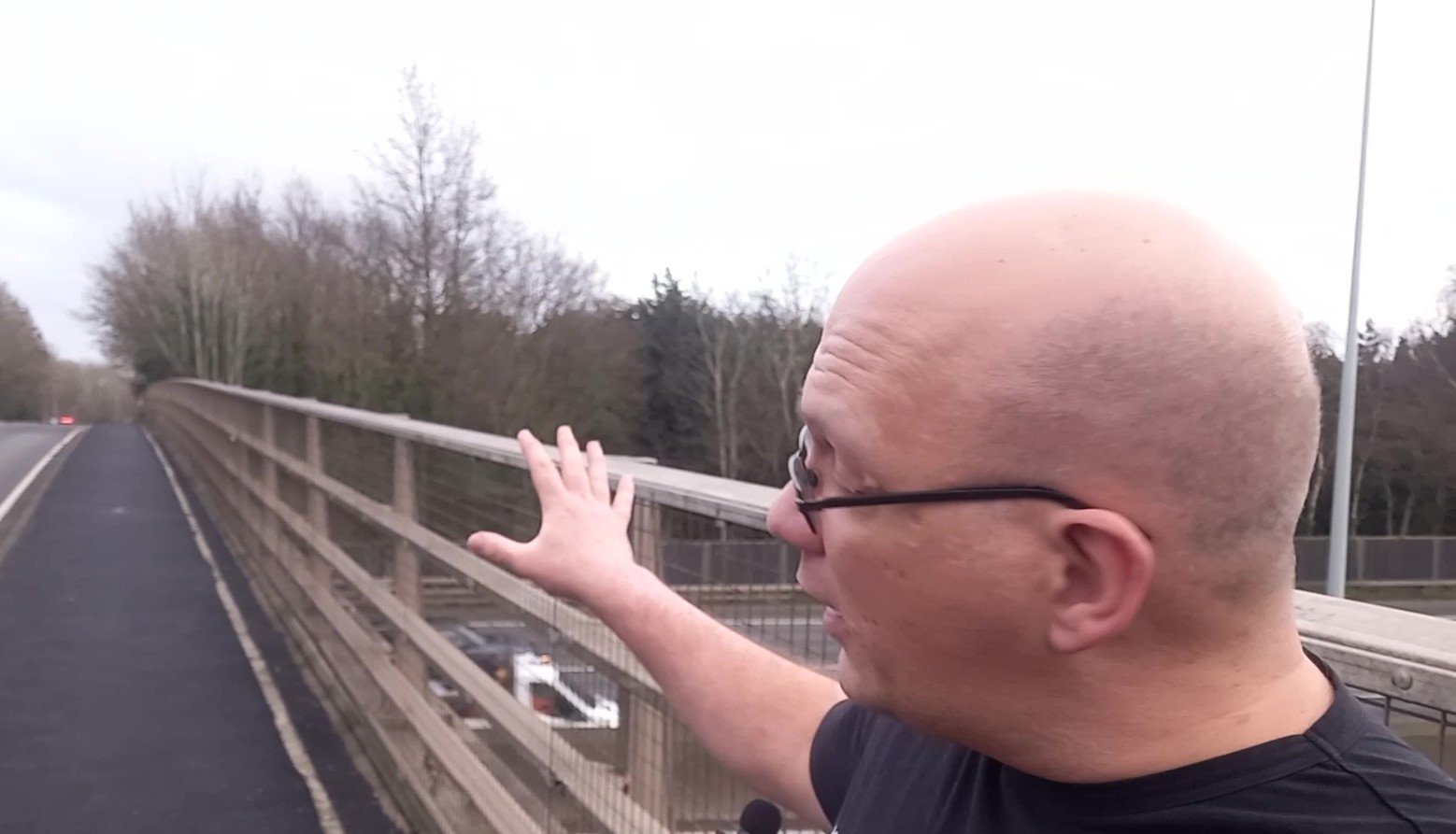 Image of our chairperson, Paul, on a motorway bridge explaining what happened in the attack.